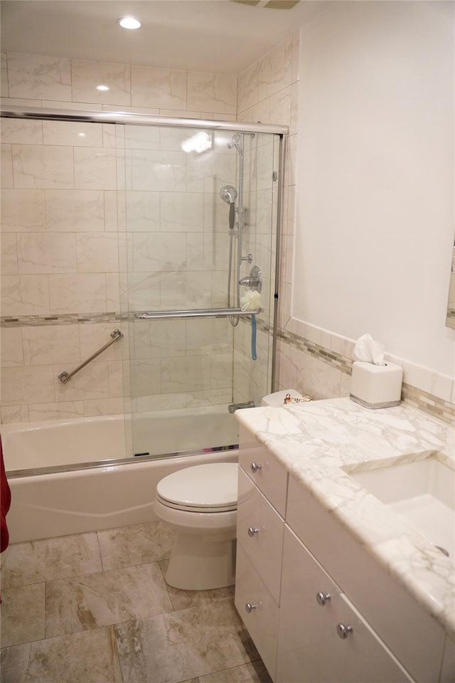 334 Central Park Ave Unit H8, Scarsdale, NY 10583 - full bathroom with shower / bath combination with glass door, vanity, toilet, tile walls, and recessed lighting