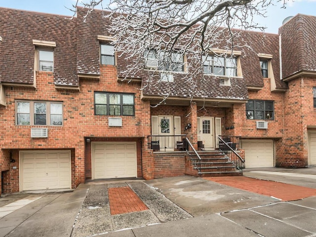 townhome / multi-family property featuring a wall mounted AC