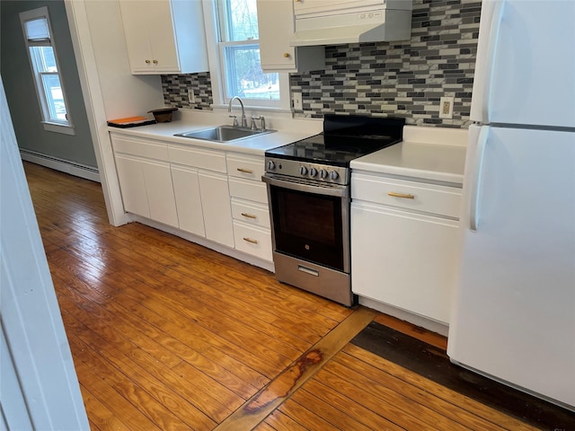 kitchen with sink, electric range, white refrigerator, extractor fan, and white cabinets