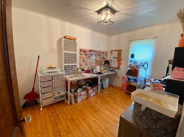 home office with hardwood / wood-style flooring and ornamental molding