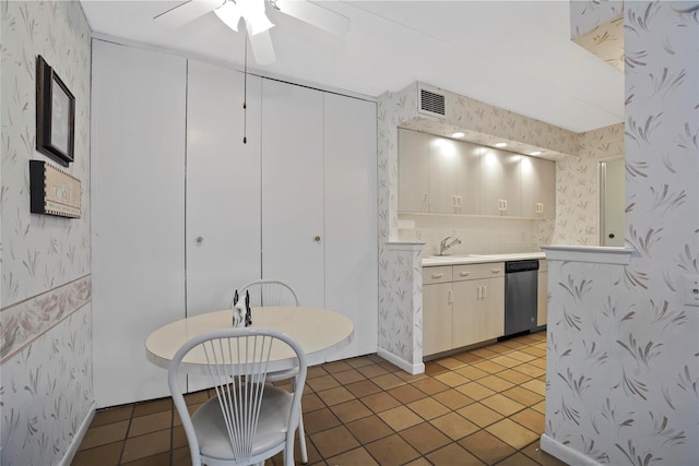 kitchen with dishwasher, sink, tile patterned floors, and ceiling fan