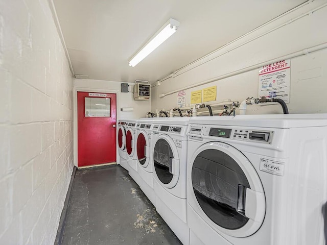 clothes washing area with independent washer and dryer