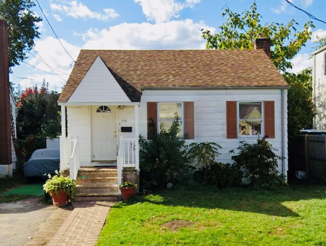 view of front of home with a front yard