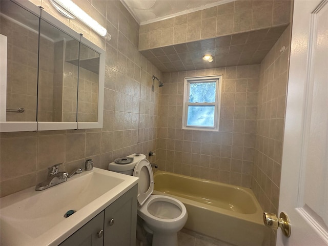 full bathroom featuring toilet, tiled shower / bath, tile walls, vanity, and decorative backsplash