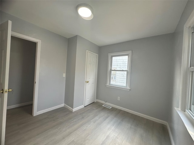 unfurnished bedroom featuring light hardwood / wood-style floors