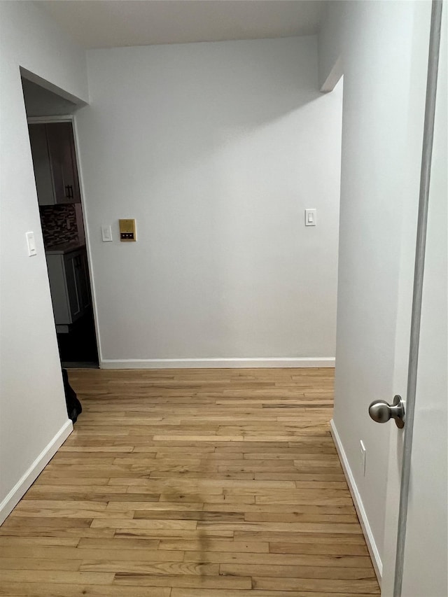 spare room featuring light hardwood / wood-style flooring