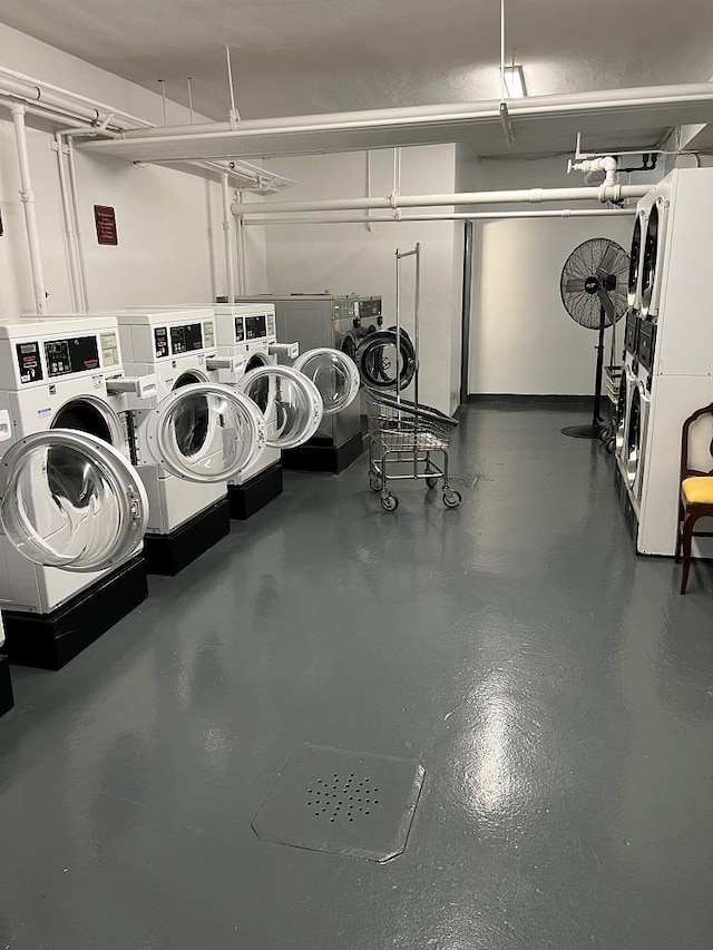 garage featuring stacked washer / dryer and separate washer and dryer