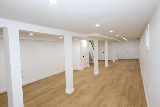 basement featuring light hardwood / wood-style flooring