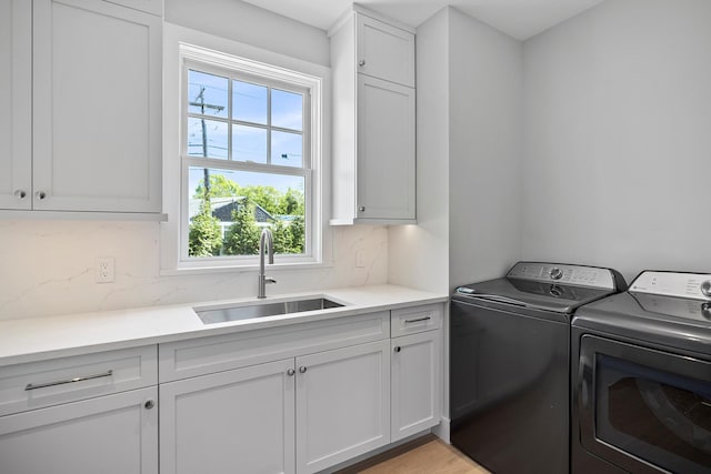 245 Mill Rd, Westhampton Beach, NY 11978 - laundry room with cabinet space and washing machine and clothes dryer
