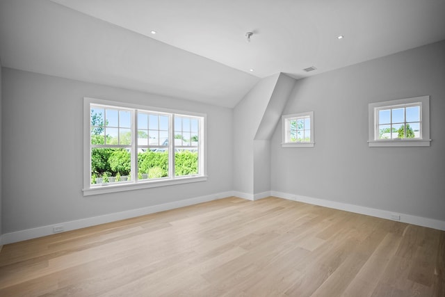 245 Mill Rd, Westhampton Beach, NY 11978 - additional living space with light wood-style floors, baseboards, vaulted ceiling, and recessed lighting