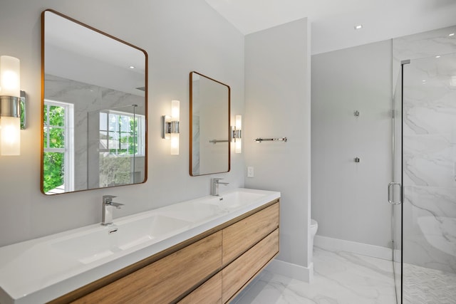 245 Mill Rd, Westhampton Beach, NY 11978 - full bathroom featuring marble look tiles, toilet, a marble finish shower, double vanity, and baseboards