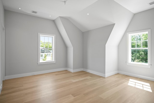 245 Mill Rd, Westhampton Beach, NY 11978 - bonus room featuring vaulted ceiling, light wood-style floors, baseboards, and recessed lighting