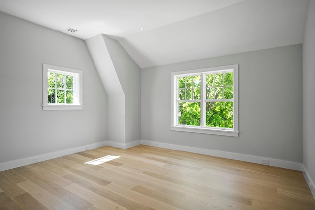245 Mill Rd, Westhampton Beach, NY 11978 - bonus room with vaulted ceiling, baseboards, and wood finished floors