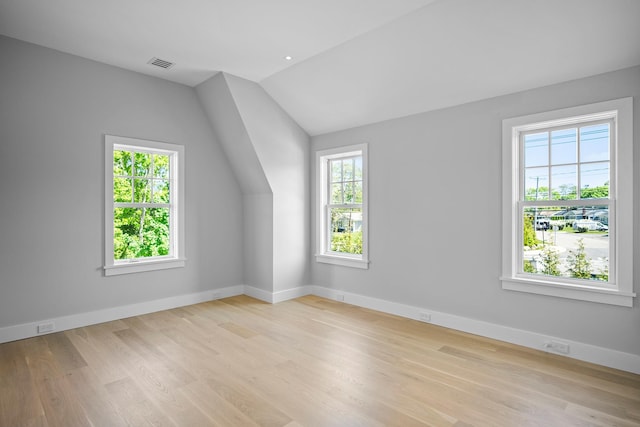 245 Mill Rd, Westhampton Beach, NY 11978 - bonus room with healthy amount of natural light, lofted ceiling, wood finished floors, and baseboards