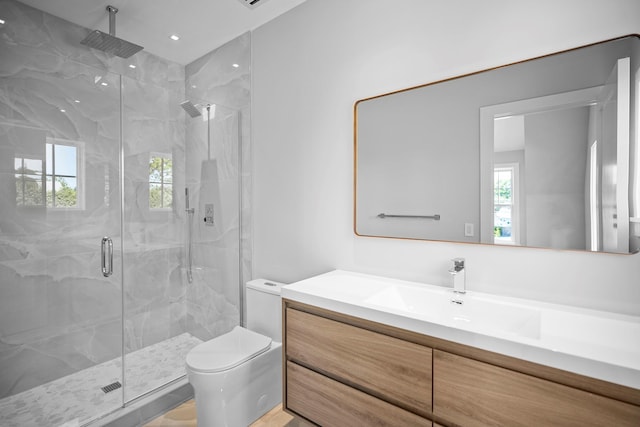 245 Mill Rd, Westhampton Beach, NY 11978 - full bathroom with a marble finish shower, vanity, and toilet