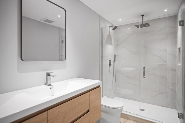 245 Mill Rd, Westhampton Beach, NY 11978 - full bathroom featuring toilet, a marble finish shower, vanity, and recessed lighting