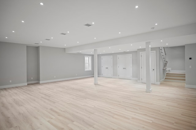 245 Mill Rd, Westhampton Beach, NY 11978 - below grade area with light wood-style flooring, baseboards, stairs, and recessed lighting