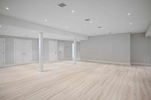 245 Mill Rd, Westhampton Beach, NY 11978 - finished below grade area featuring light wood finished floors, recessed lighting, and baseboards