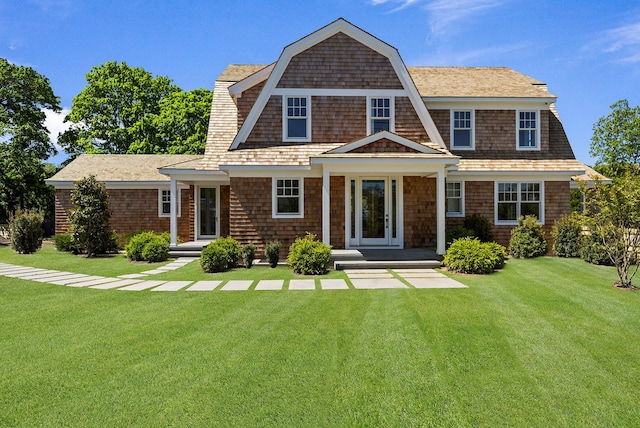 245 Mill Rd, Westhampton Beach, NY 11978 - shingle-style home with a front yard and a gambrel roof