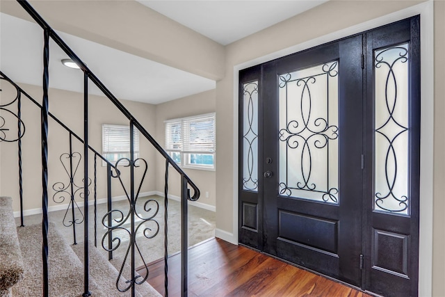 foyer entrance with dark hardwood / wood-style flooring