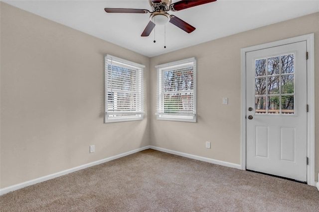 carpeted empty room with ceiling fan