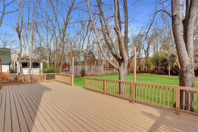 wooden deck with a lawn