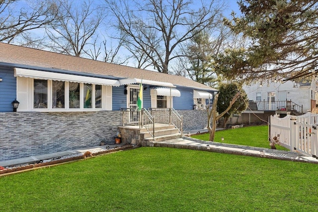 ranch-style house with a front lawn