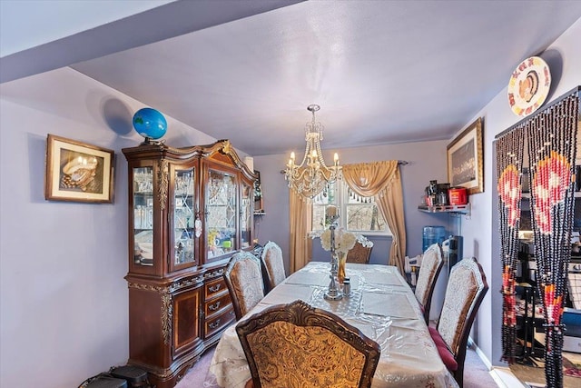 carpeted dining space with a chandelier