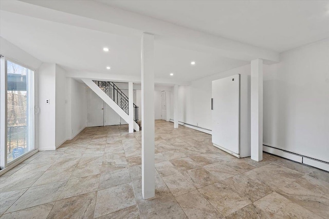 basement with a baseboard heating unit