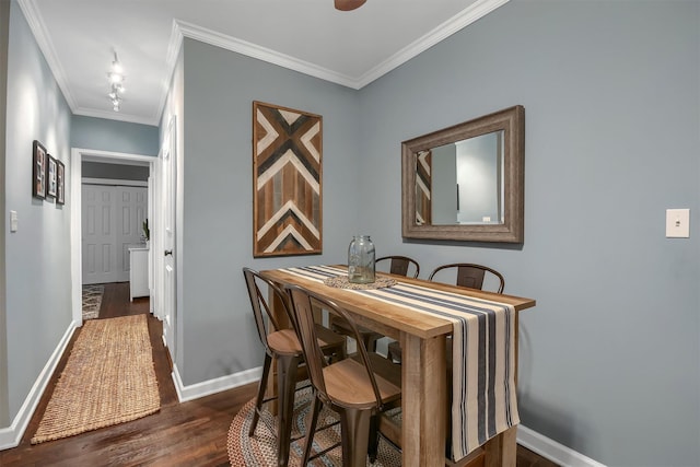 dining space featuring crown molding and dark hardwood / wood-style floors