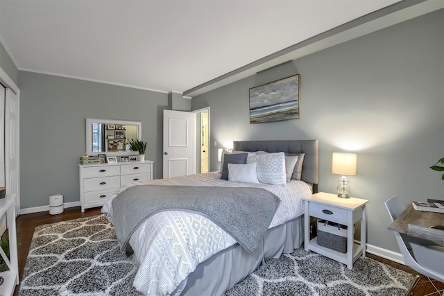 bedroom with dark wood-type flooring and crown molding