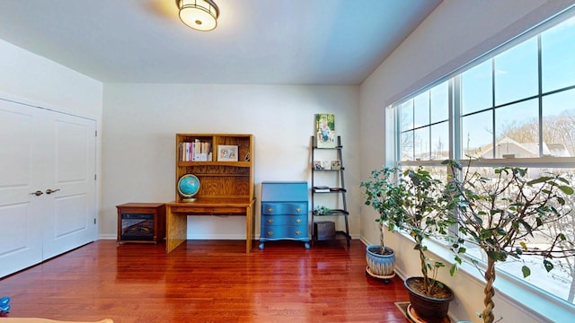 misc room with dark wood finished floors and baseboards