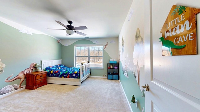 bedroom featuring a ceiling fan, light colored carpet, and baseboards