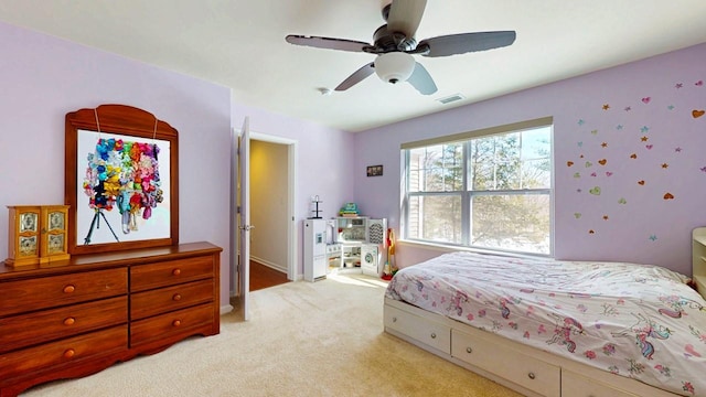 bedroom with light carpet, baseboards, visible vents, and a ceiling fan