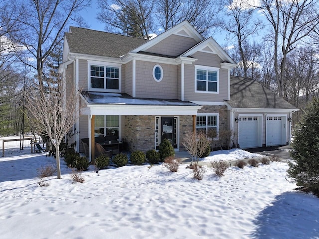 view of front of home featuring stone siding and an attached garage