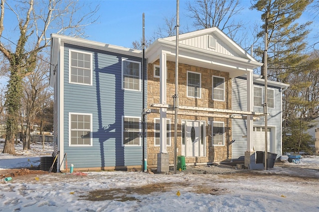 view of front of house featuring a porch and a garage