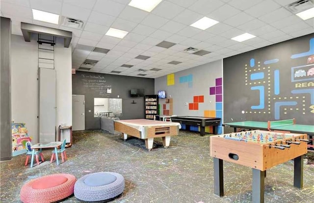 recreation room with a drop ceiling