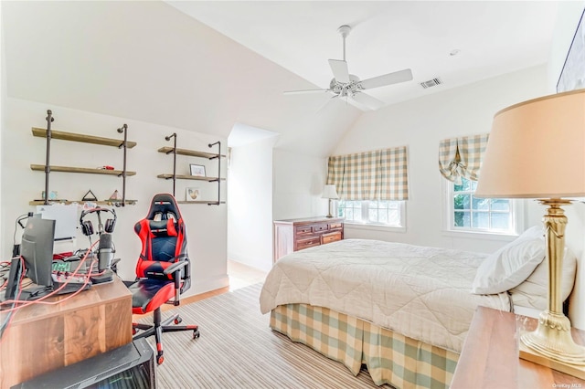 bedroom featuring ceiling fan and lofted ceiling