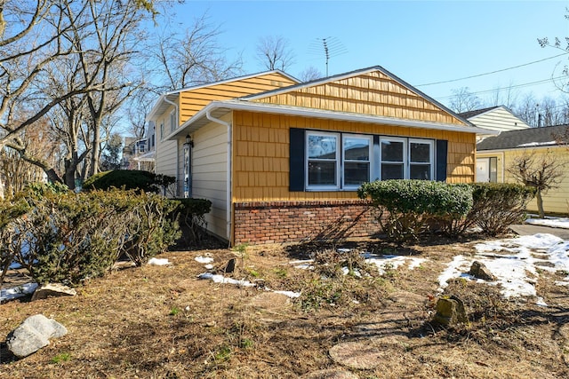 view of home's exterior with brick siding