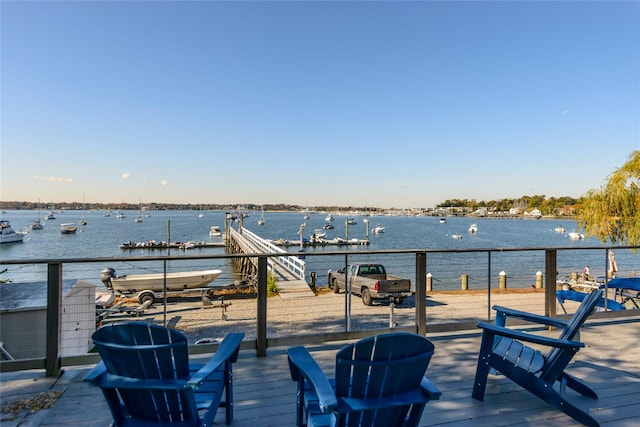 wooden terrace featuring a water view