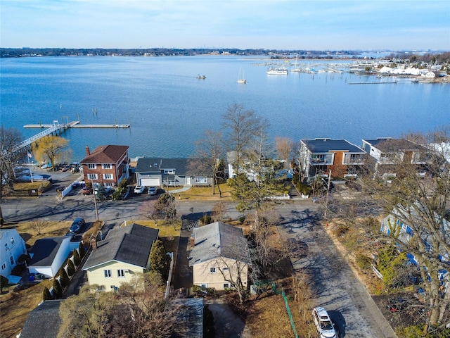 drone / aerial view featuring a water view and a residential view