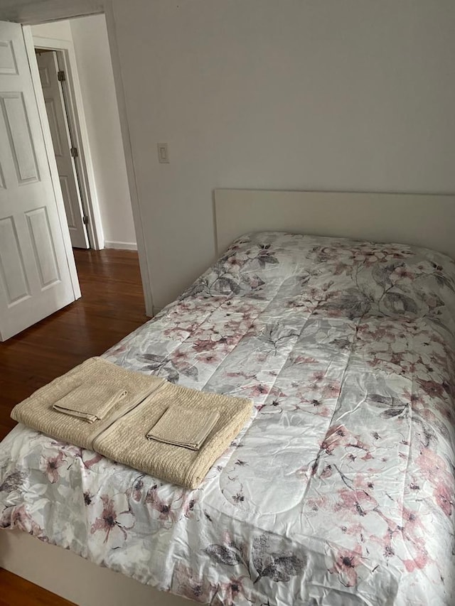 bedroom featuring hardwood / wood-style flooring