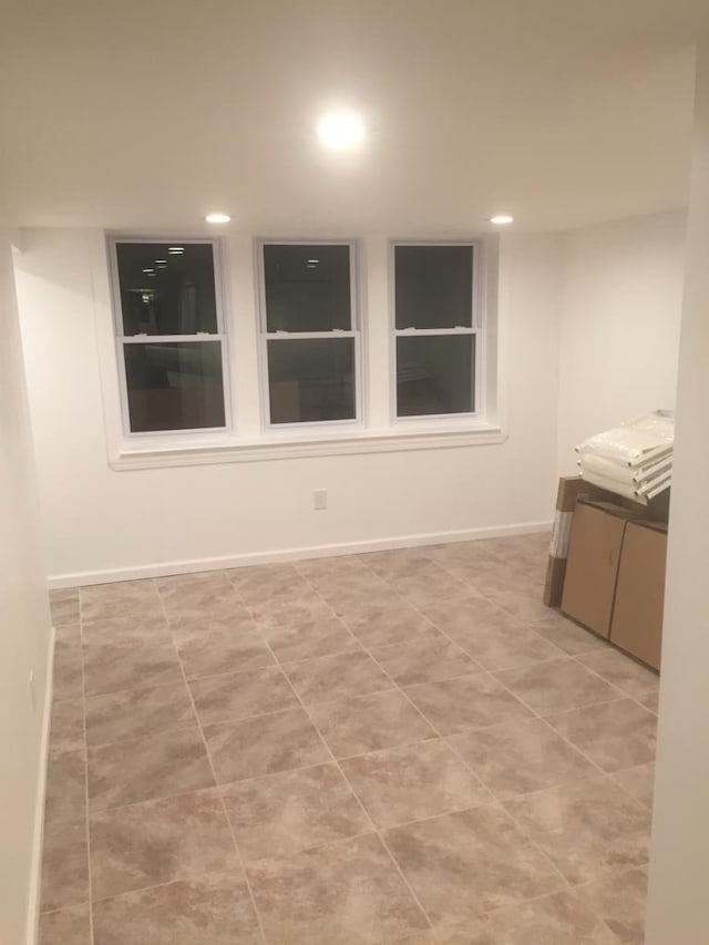 spare room featuring light tile patterned floors