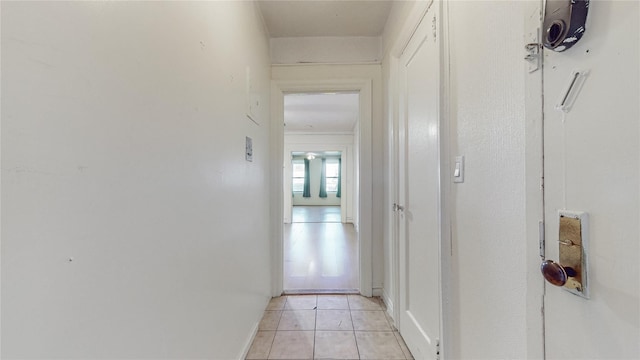 hallway featuring light tile patterned floors