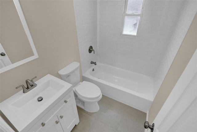 full bathroom featuring tile patterned flooring, vanity, tiled shower / bath, and toilet