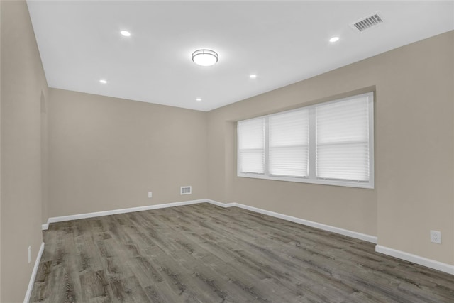 empty room featuring wood-type flooring