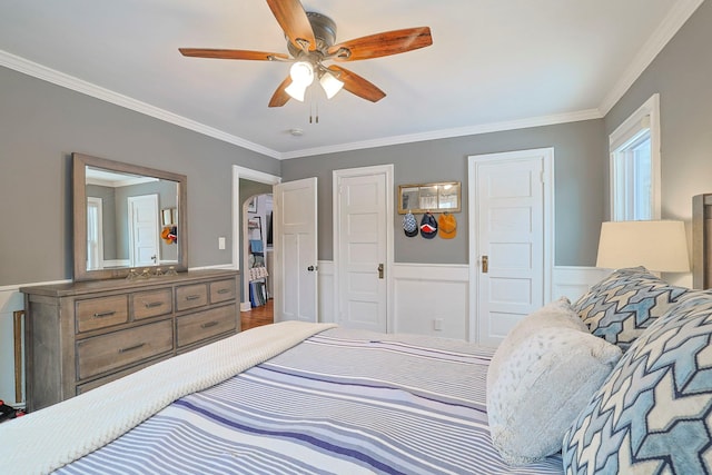 bedroom featuring ceiling fan and ornamental molding