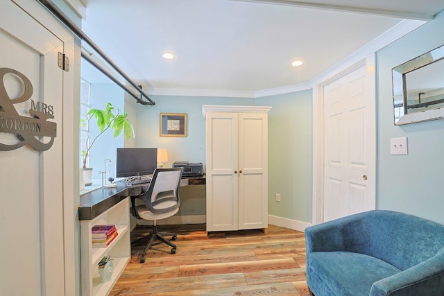 office featuring ornamental molding and light hardwood / wood-style flooring