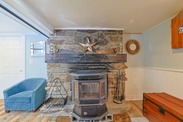 room details featuring crown molding, a wood stove, and hardwood / wood-style floors