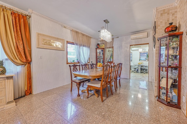 dining space featuring an AC wall unit, ornamental molding, granite finish floor, and an inviting chandelier